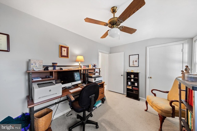 office area with light colored carpet, lofted ceiling, and ceiling fan