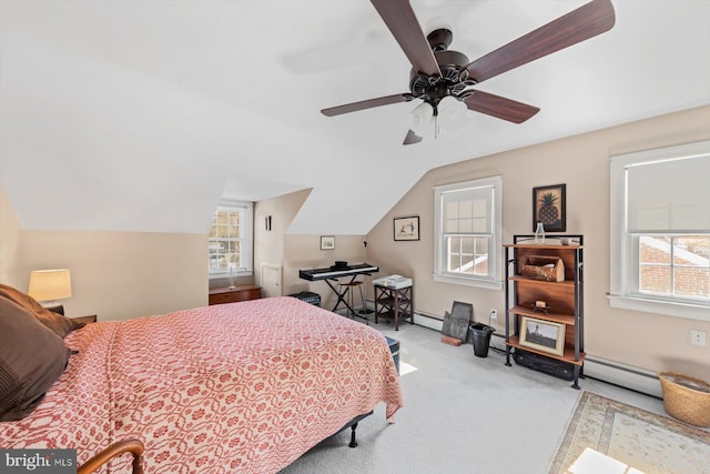 carpeted bedroom featuring ceiling fan, multiple windows, and lofted ceiling