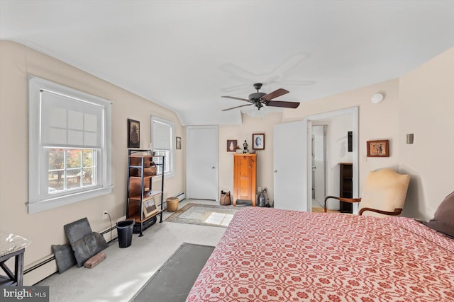 bedroom featuring a baseboard radiator, light colored carpet, and ceiling fan