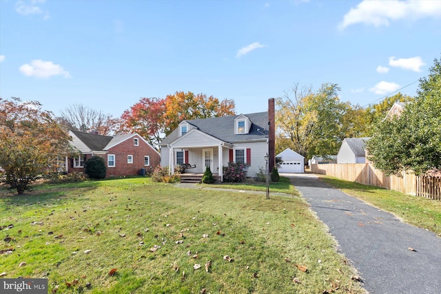 view of front of house with a garage and a front lawn