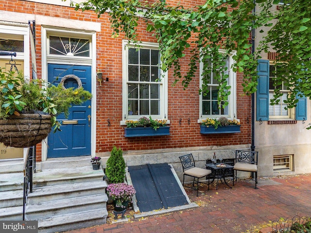 entrance to property with a patio