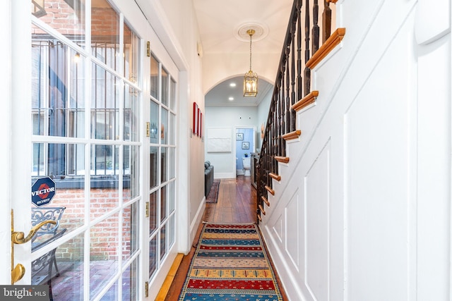 hallway with dark hardwood / wood-style flooring