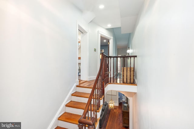 staircase featuring hardwood / wood-style flooring