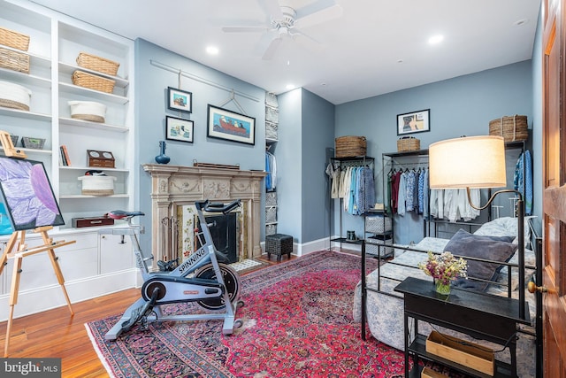 interior space with hardwood / wood-style floors and ceiling fan