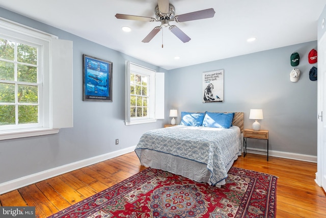 bedroom featuring ceiling fan and light hardwood / wood-style flooring