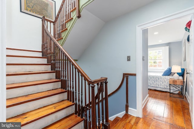 stairway featuring hardwood / wood-style floors