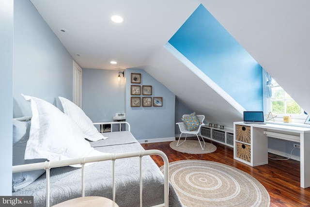 bedroom with hardwood / wood-style flooring and vaulted ceiling