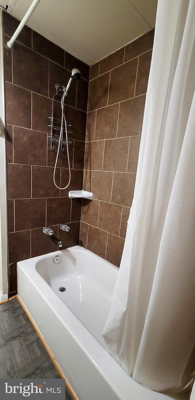 bathroom featuring shower / bath combo with shower curtain