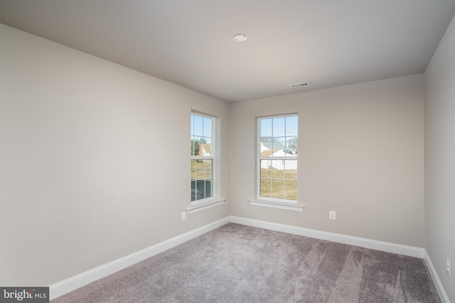 view of carpeted spare room