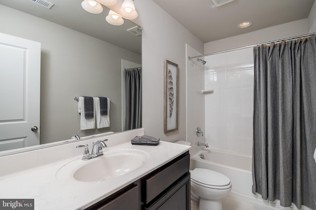 full bathroom with vanity, shower / bath combination with curtain, and toilet