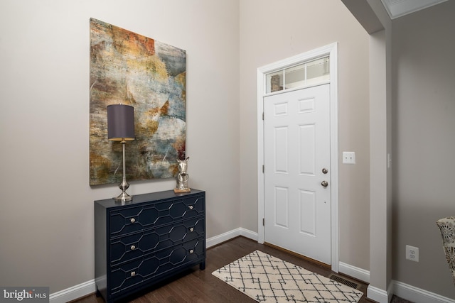 entryway with dark wood-type flooring