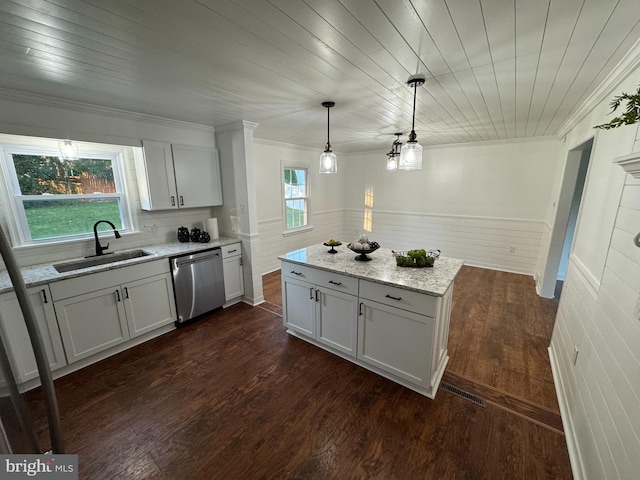 kitchen featuring white cabinetry, plenty of natural light, pendant lighting, sink, and stainless steel dishwasher