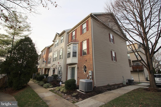 view of property featuring central air condition unit