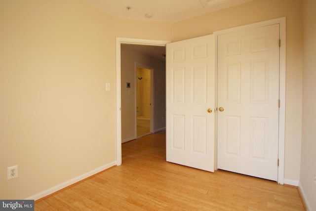 unfurnished bedroom with light hardwood / wood-style floors