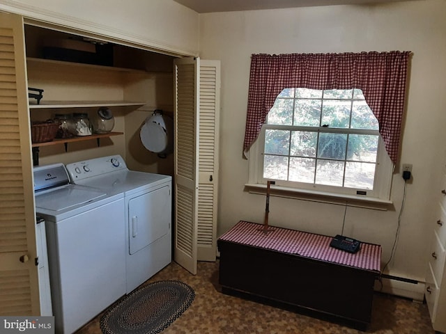 laundry room with baseboard heating and separate washer and dryer