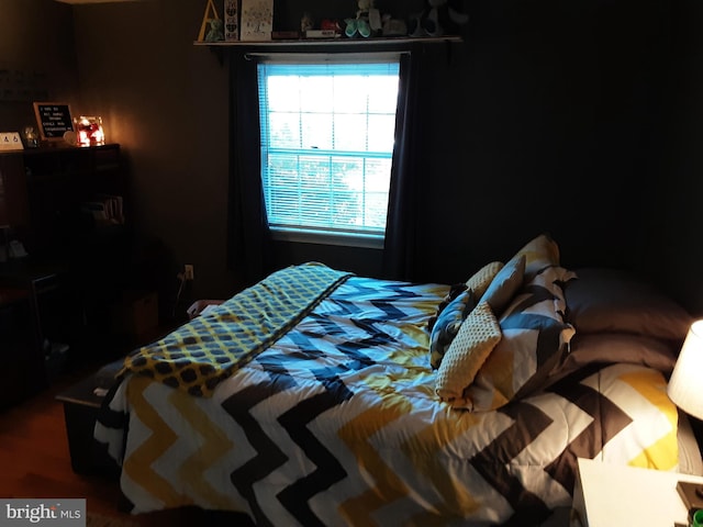 bedroom featuring wood-type flooring