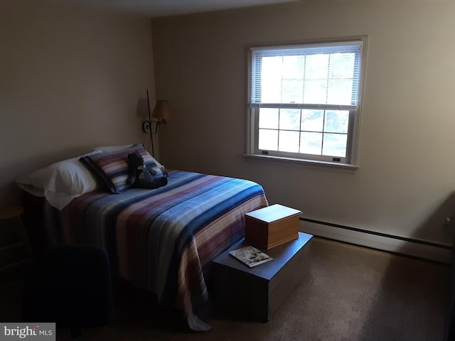 carpeted bedroom with a baseboard radiator