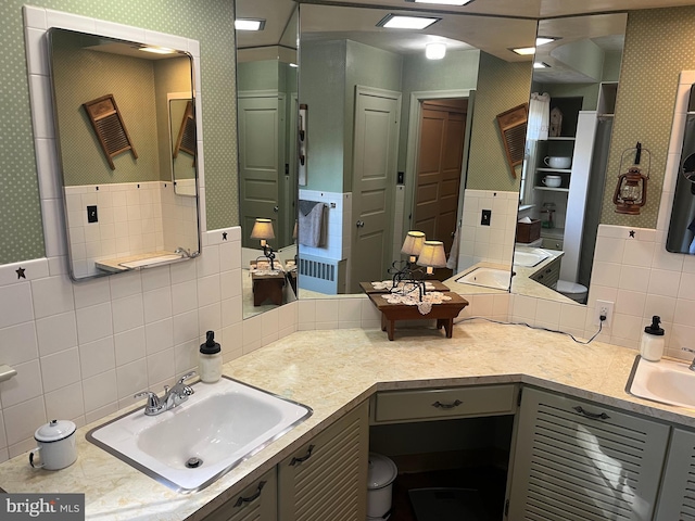 bathroom featuring vanity and decorative backsplash