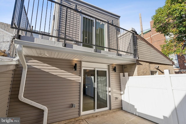 rear view of property with a balcony