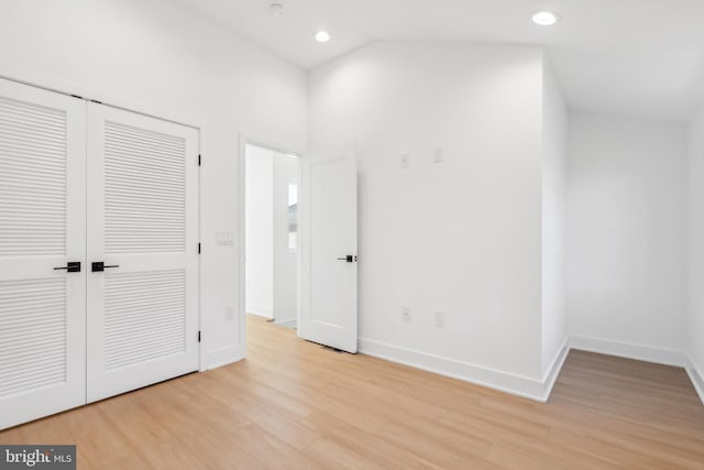 unfurnished bedroom featuring a closet and light hardwood / wood-style floors