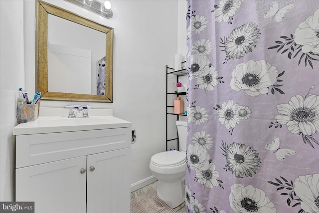 bathroom with toilet and vanity