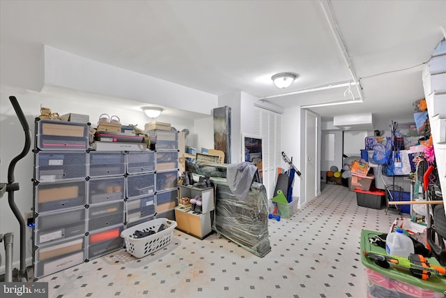 storage room with a wall mounted air conditioner