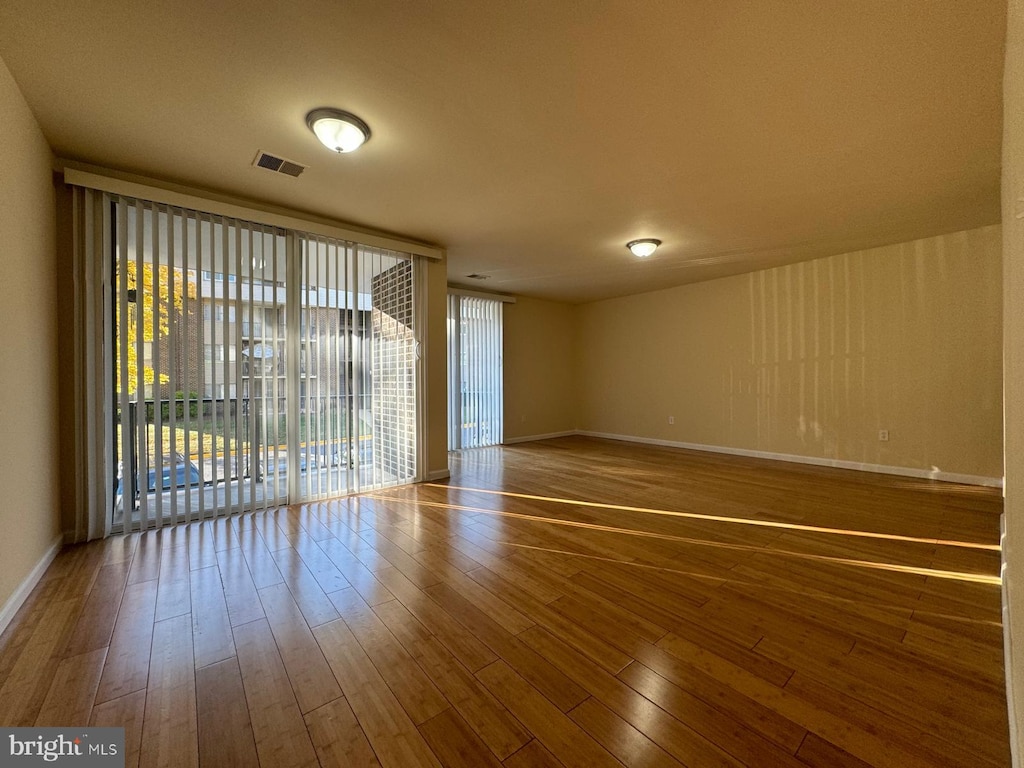 spare room featuring hardwood / wood-style flooring