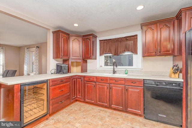 kitchen with kitchen peninsula, wine cooler, dishwasher, and sink