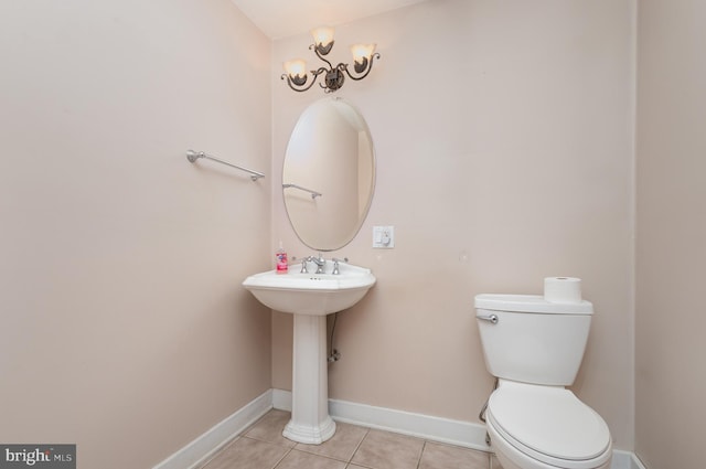 bathroom featuring tile patterned floors and toilet