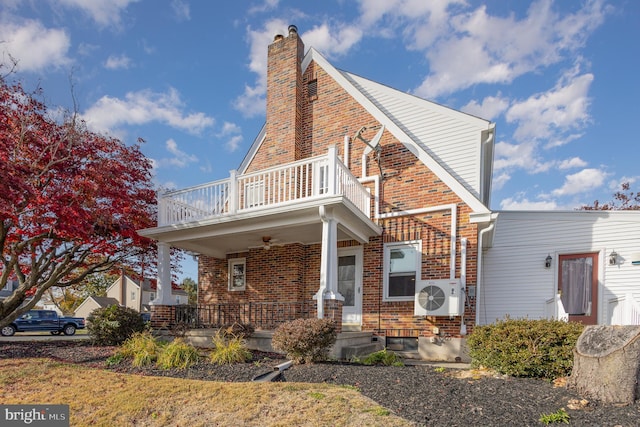 exterior space with covered porch and ac unit