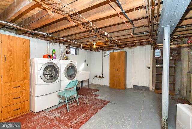 interior space featuring sink and washer and dryer