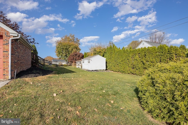 view of yard with a storage shed