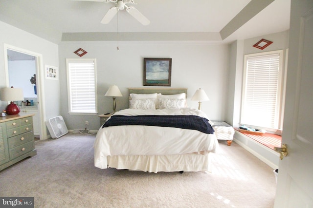 bedroom featuring light carpet and ceiling fan