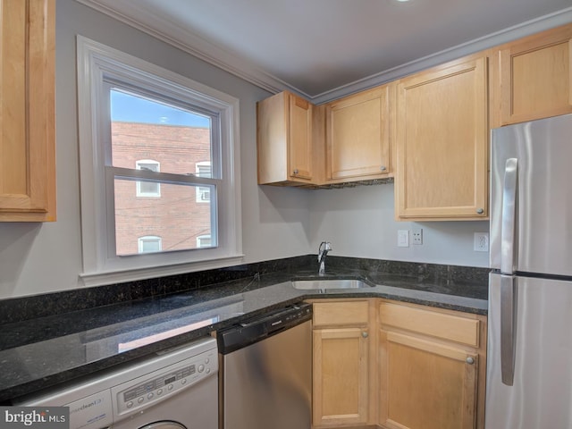 kitchen featuring sink, washer / dryer, light brown cabinetry, and appliances with stainless steel finishes