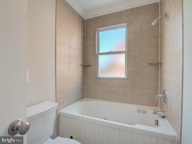 bathroom featuring tiled shower / bath combo, ornamental molding, and toilet