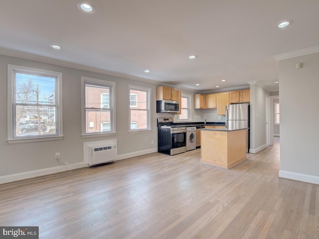 kitchen featuring a center island, stainless steel appliances, light brown cabinetry, light hardwood / wood-style floors, and ornamental molding