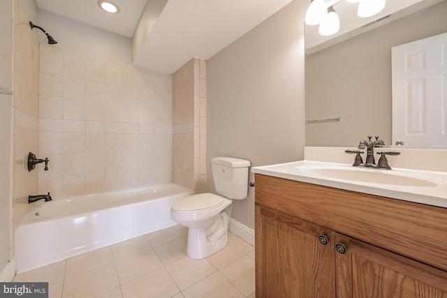 bathroom with bathtub / shower combination, tile patterned floors, toilet, vanity, and baseboards