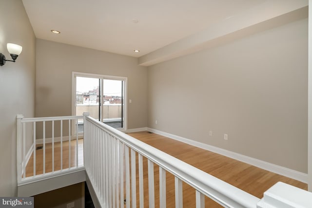 corridor featuring hardwood / wood-style floors