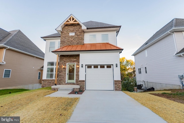 craftsman-style house featuring a front lawn and a garage