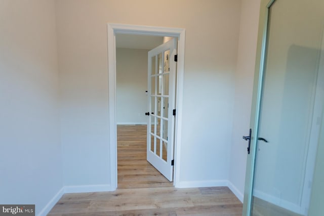 hall with light wood-type flooring