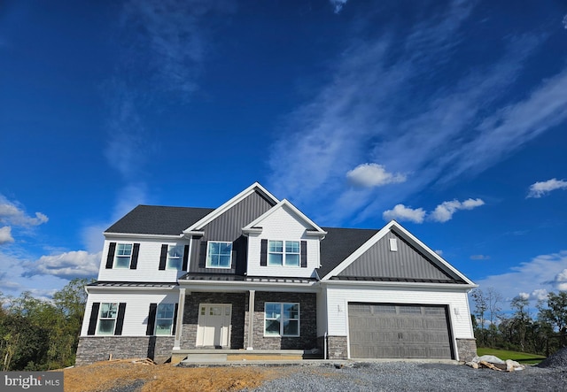 craftsman house featuring covered porch and a garage