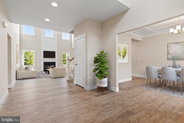 entryway with a chandelier and light hardwood / wood-style flooring