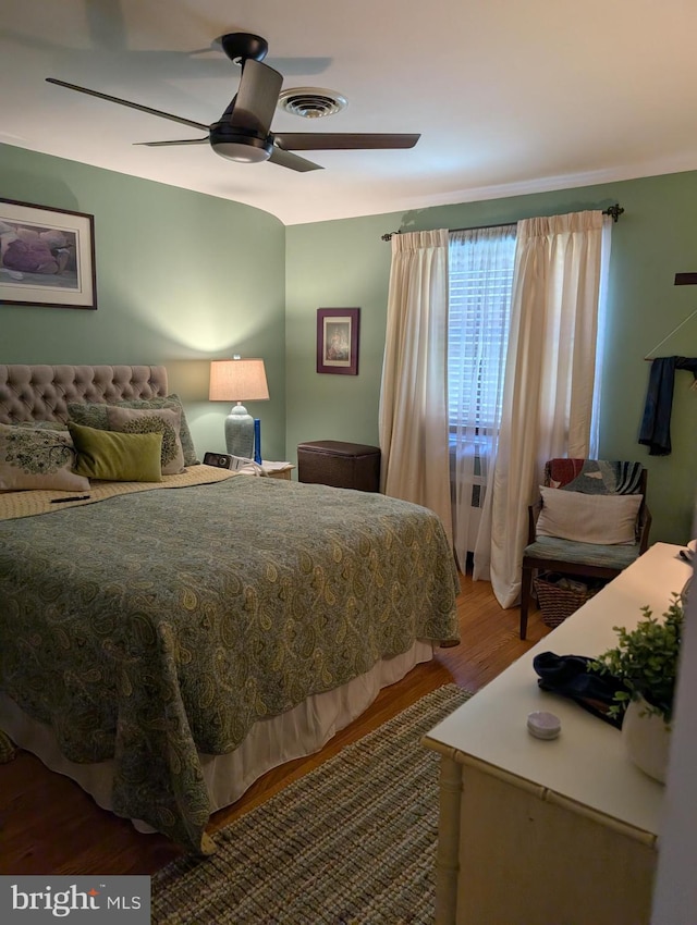 bedroom featuring hardwood / wood-style floors and ceiling fan