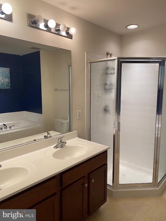 full bathroom featuring vanity, plus walk in shower, toilet, and tile patterned flooring