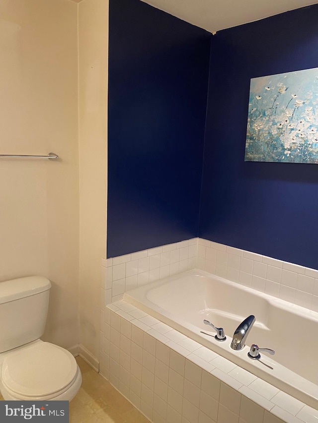 bathroom with toilet and a relaxing tiled tub