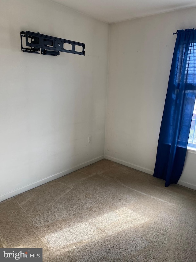 spare room with carpet floors