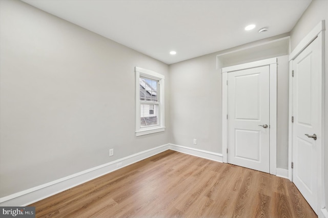 empty room with light hardwood / wood-style floors