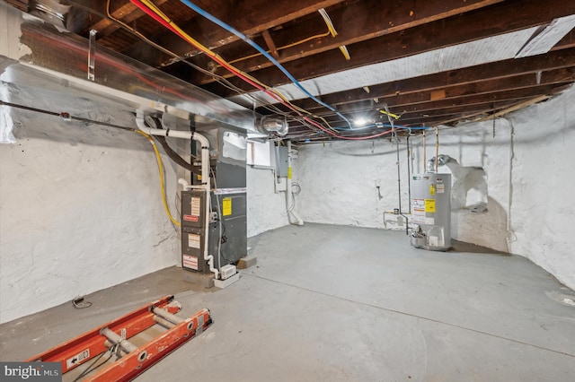 basement with gas water heater and heating unit