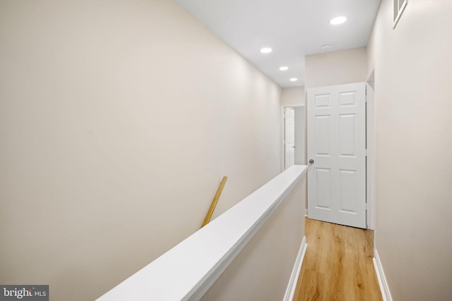 hall with light hardwood / wood-style floors