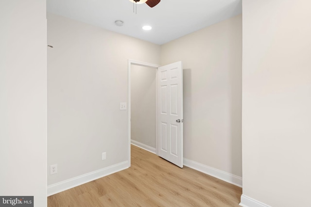 spare room featuring light wood-type flooring and ceiling fan